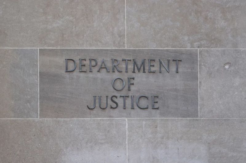  Semnul Departamentului de Justiție este văzut pe clădirea din Washington DC