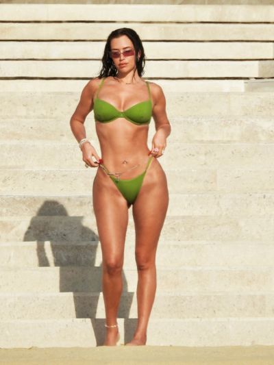   YKSINKERTAINEN: Kylie Jenner's best friend Anastasia 'Stassie' Karanikolaou looks incredible in a lime green bikini as she hits the beach over the Thanksgiving holiday. The model and social media influencer, 25, showed off her slimline figure as she and a friend walked along the sand near the luxury Nobu Hotel in Cabo San Lucas, Mexico. 24 Nov 2022 Pictured: Anastasia 'Stassie' Karanikolaou. Photo credit: MEGA TheMegaAgency.com +1 888 505 6342 (Mega Agency TagID: MEGA920866_001.jpg